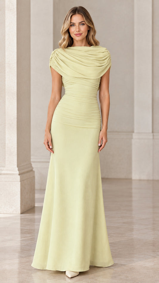 Front full-length view of model wearing pale yellow draped cowl neck ruched maxi gown