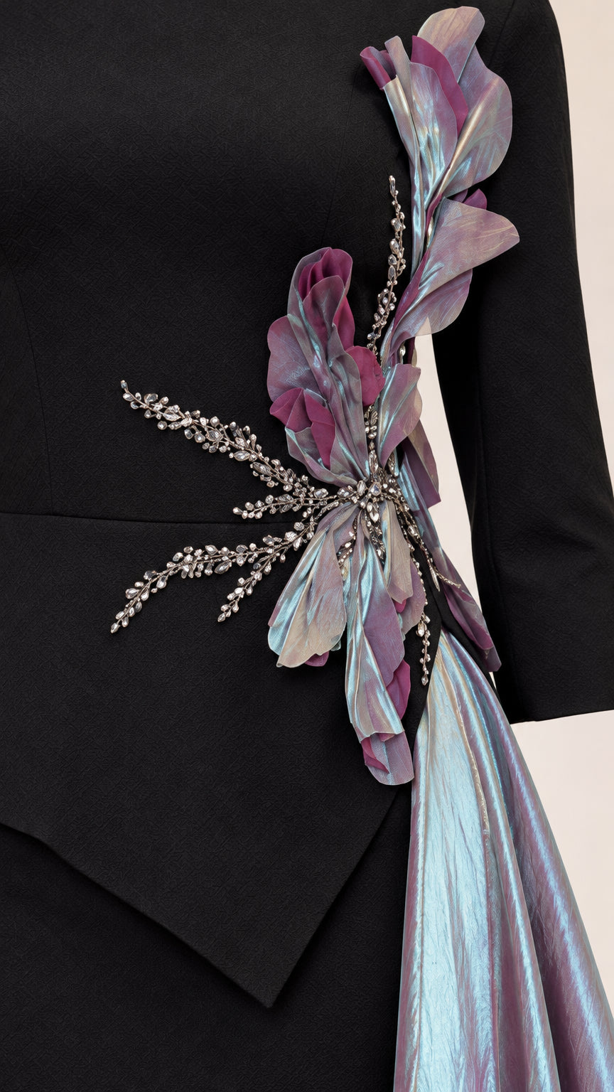 Close-up detail of 3D floral embellishment, crystal beading, and iridescent drape texture