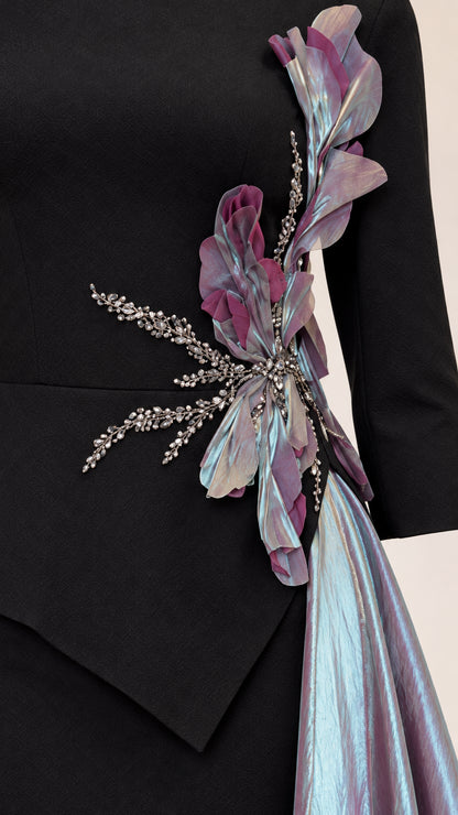 Close-up detail of 3D floral embellishment, crystal beading, and iridescent drape texture